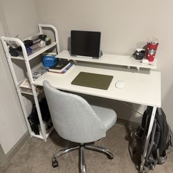 White desk w/ monitor stand & shelves + blue/gray armless swivel chair 