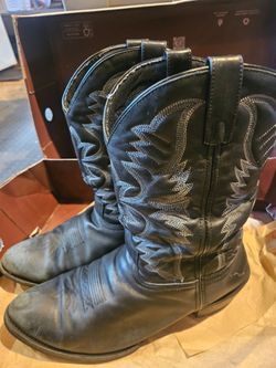Durable Laredo western cowboy boots are size 14 EW for men.