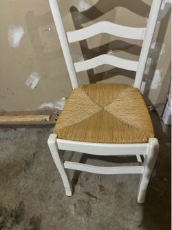 4 brown and white chairs