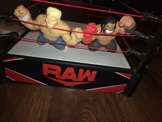 RAW ring with two wrestlers