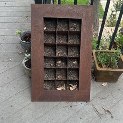 Hanging Metal Garden Frame With Pockets To Plant Individual Plants In The “” Area. 