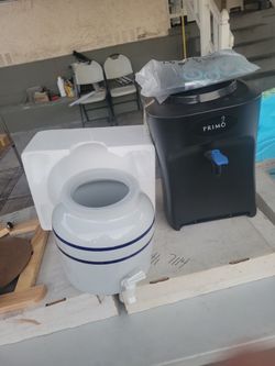 Two primo countertop top water dispenser