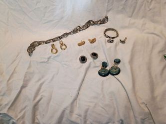 Assorted earrings and belt
