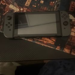 Gray Nintendo Switch With Games