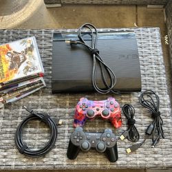 PS3 Super Slim Console 2 Controllers And Games