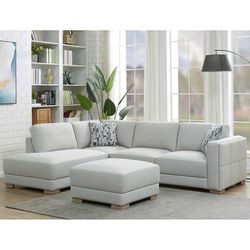 New Drayden Fabric Sectional with Ottoman  Retails for over $1,400  Features: Pocket Coil Seat Cushion Sinuous Spring Seat Support Solid Wood Legs Inc