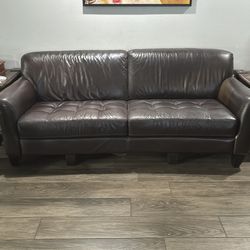 Brown leather couch and chair