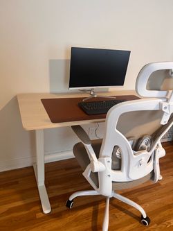 Adjustable office electric desk with chair .