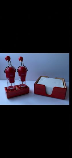 Salt and pepper grinder set with napkin holder