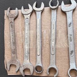 Five-piece wrench lot featuring a mix of open-end and combination wrenches from several manufacturers.