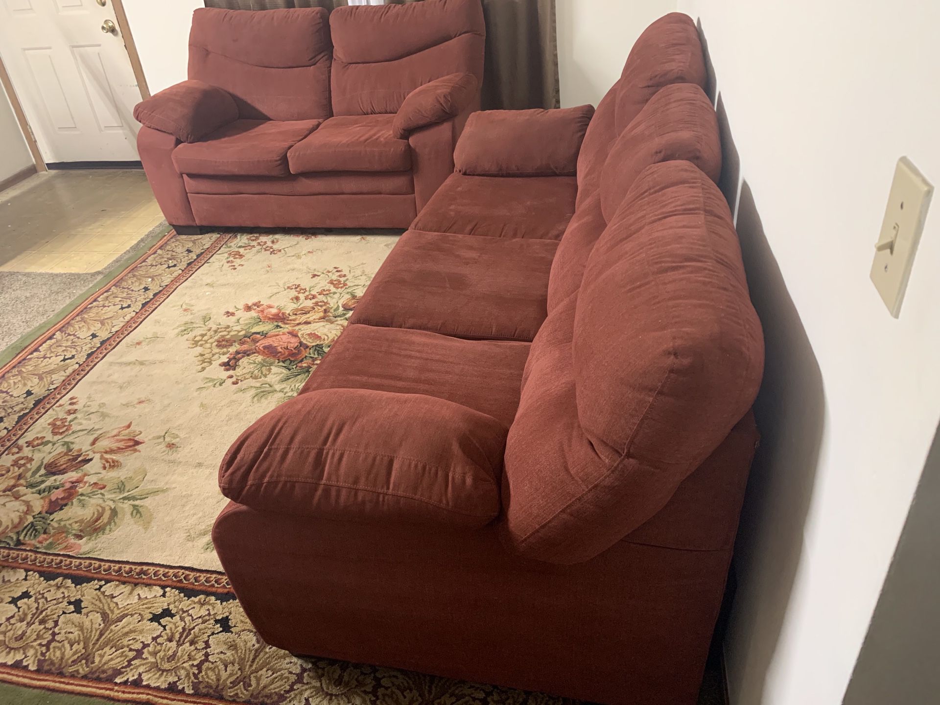 Couch it’s nice and clean it’s both red suede nothing wrong no rips or stains no pets or smoke it’s very comfortable
