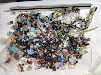 Over 2 pounds of a variety of beautiful exotic and detailed beads and magnetic beads ready to use.