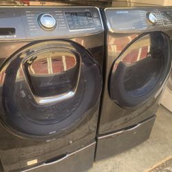 XL Samsung Stainless Steel Washer And Electric Dryer On Pedestals