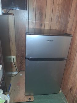 Galanz mini fridge. Silver doors black outside.