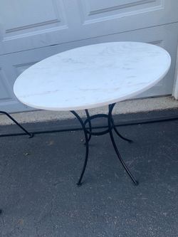 Iron base marble top table