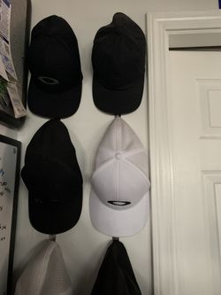 Various Nike And Oakley Hats.