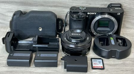 Sony Alpha A6000 Mirrorless Camera 16-50MM Lens Battery Grip Charger (PO1027325)