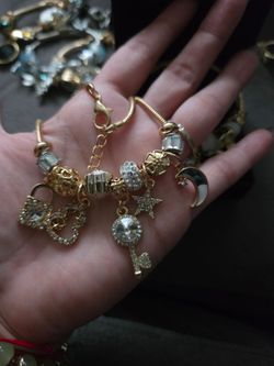 Gold-Tone Charm Bracelet with Crystal Charms and Necklace