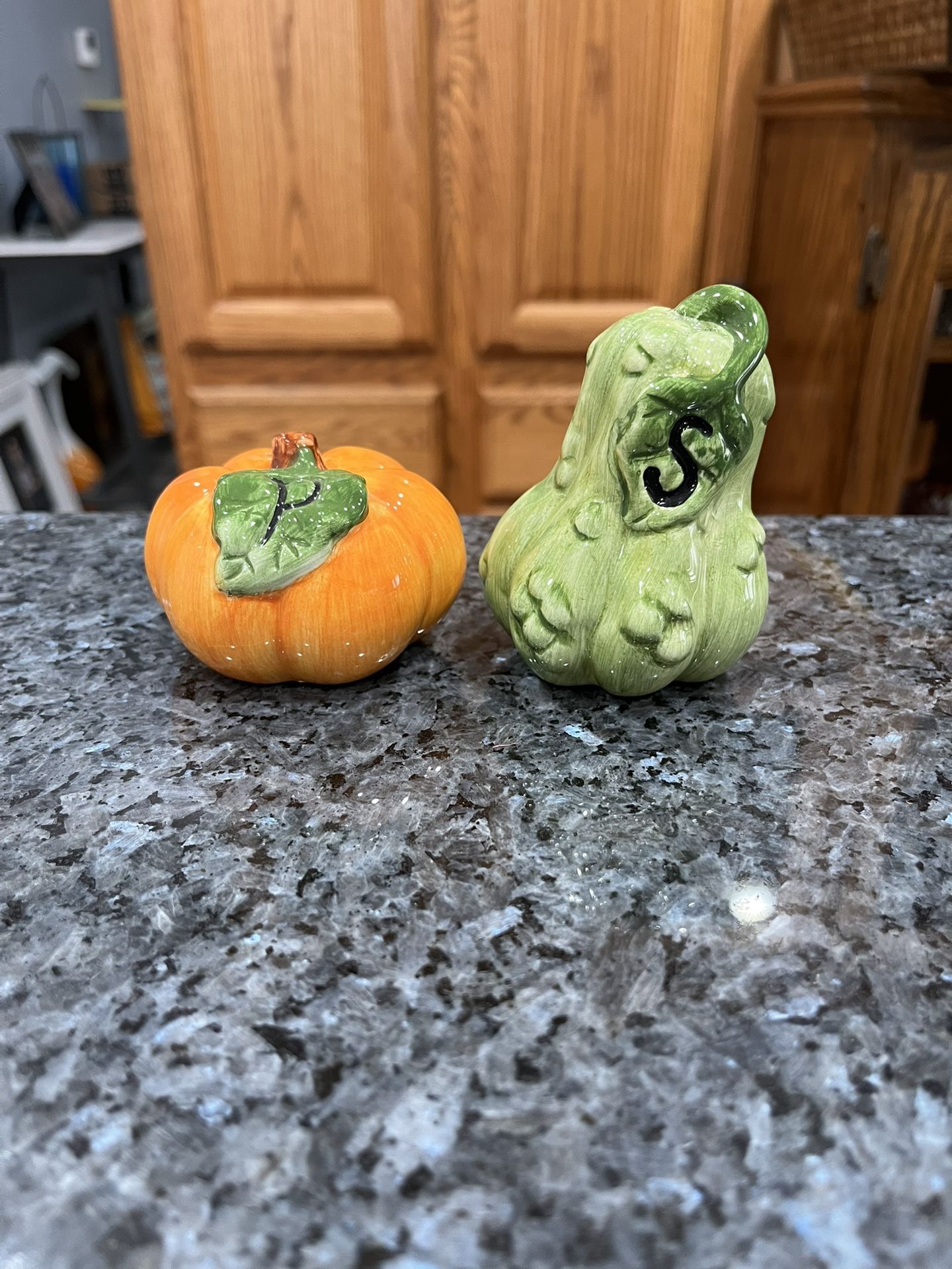 Vintage Ceramic Fall Theme Pumpkin And Gourd Pair of Salt and Pepper Shakers.  Size approximately Pumpkin 2 inches tall and Gourd 3 1/4 inches tall.  