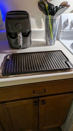 A flat griddle. It's iron skillet