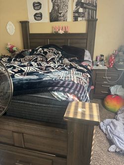 Queen size bed with two side tables and storage
