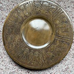 Vintage wooden plate with copper sculpture