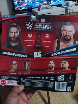 Roman Reigns and Bron breker pack