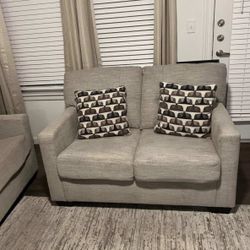 beige upholstered loveseat