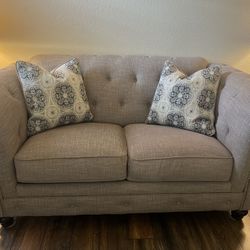 Ashley Love Seat in Neutral color
