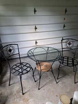 Beautiful Pier One Glasstop Table W Two.matching Chairs Ready To Go. Perfect Condition. Surface Is Black Wrought Iron