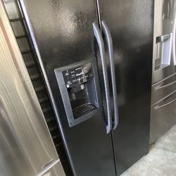 Black color ge refrigerator side by side with ice maker and water dispenser