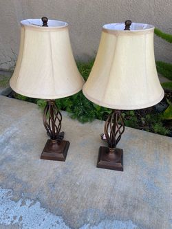Selling two lamps in good condition, measurement are 12”D on shade and 27”H