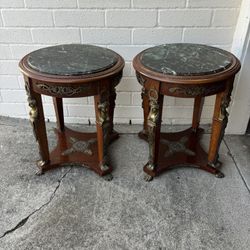 Empire style gueridon side tables with a green marble top and brass mounts