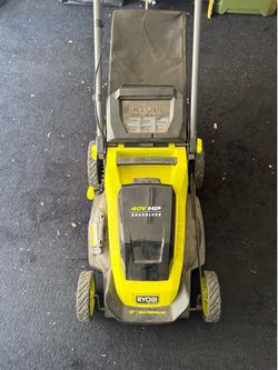 Electric lawn mower w/rechargeable battery and base