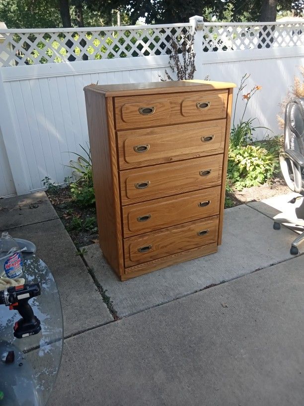Solid Wood Five Drawer Dresser With Oak Finish And Mirror