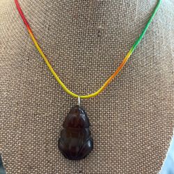 New Brown Jade Necklace Featuring a Frog. See picture for measurement. Available in Coral Gables.