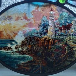 Vintage Stain Glass Lighthouse Artwork Next To Ocean