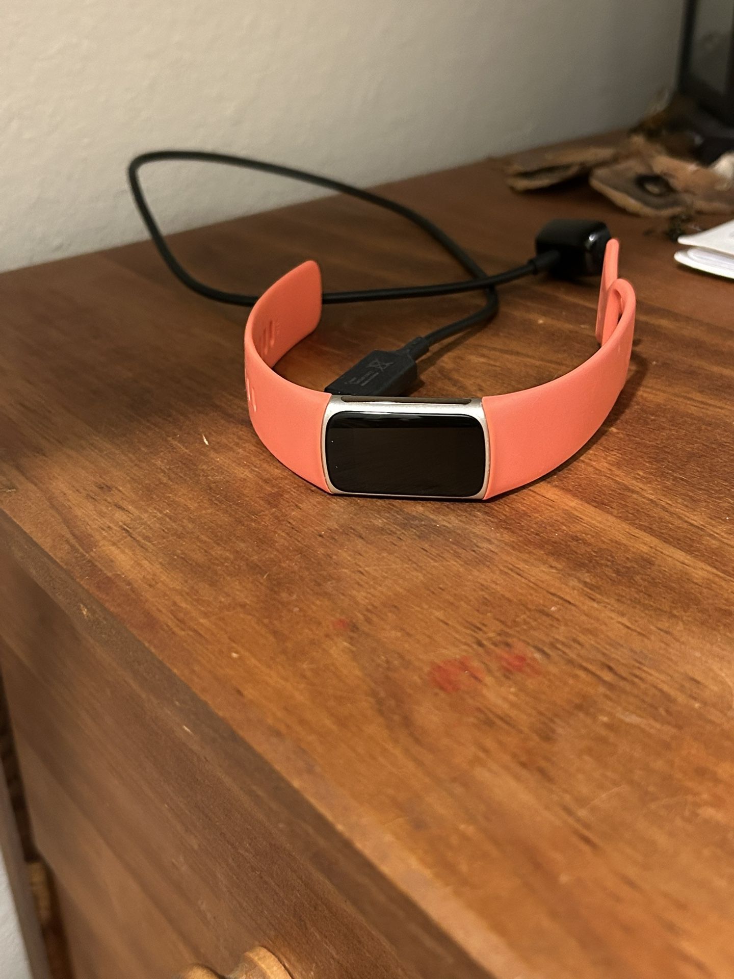 Fitbit Charge 6 with Coral Band