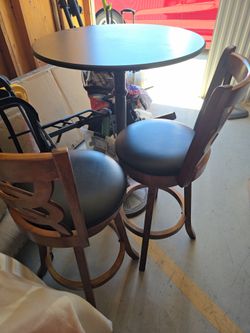Bar style table and bar stools