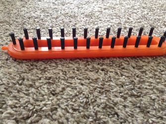 Objeto para hacer bufandas