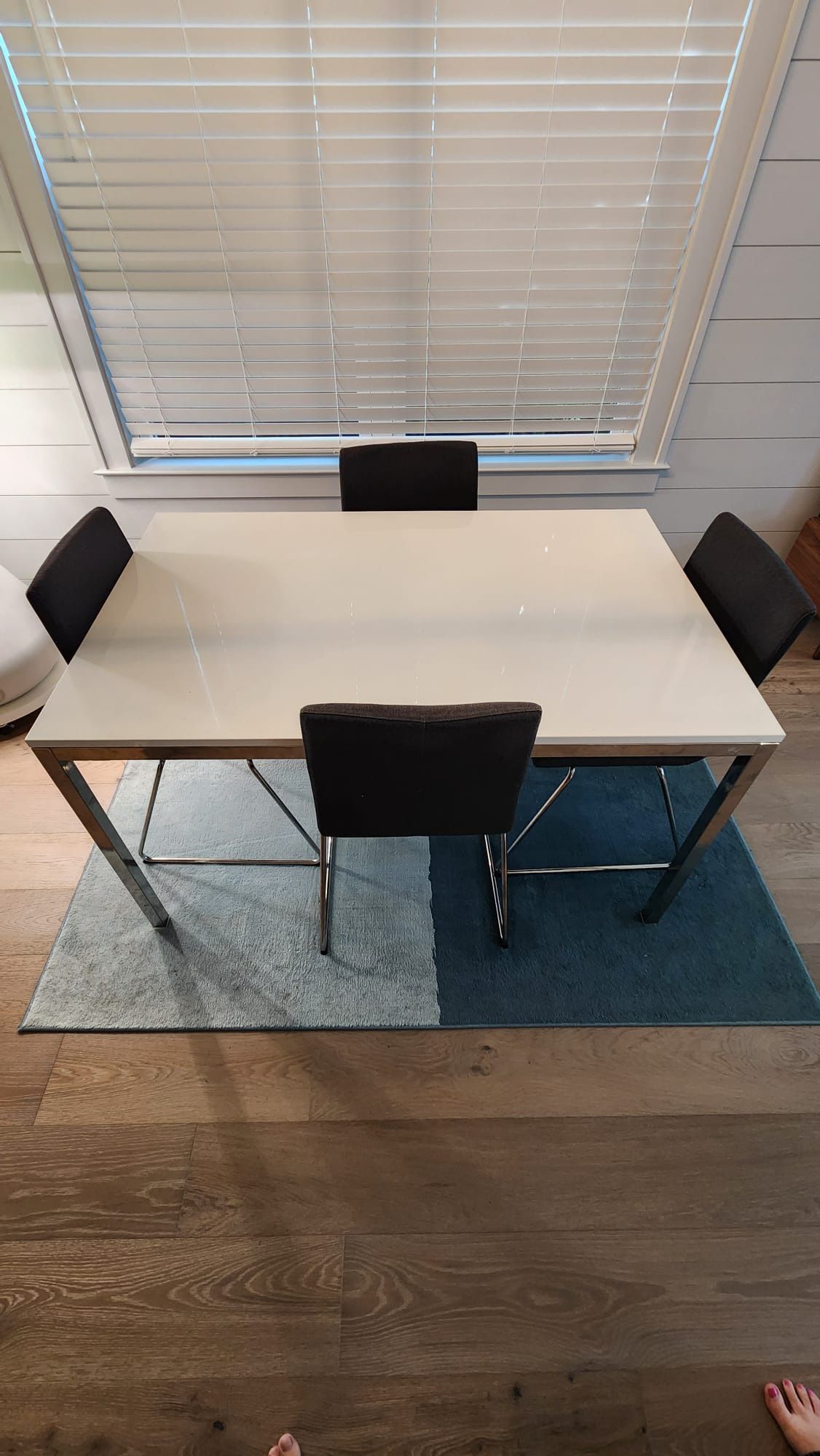 glass-top dining table with chrome legs + matching 4 IKEA Volfgang Chairs