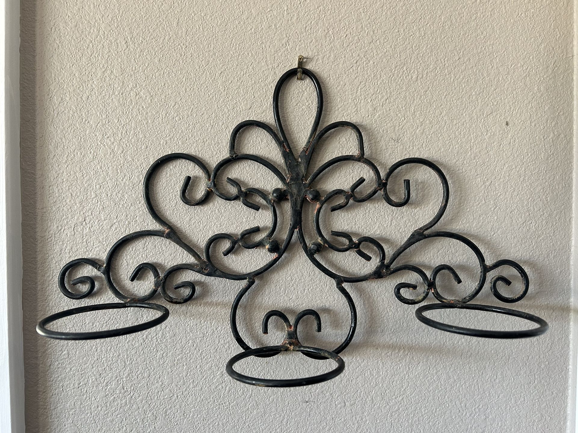 Wrought iron wall candle holder