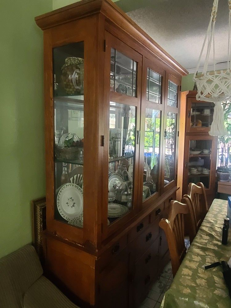 Free. Bassett mission style Oak china cabinet with lighted top And Glass & Wood Curio Cabinet
