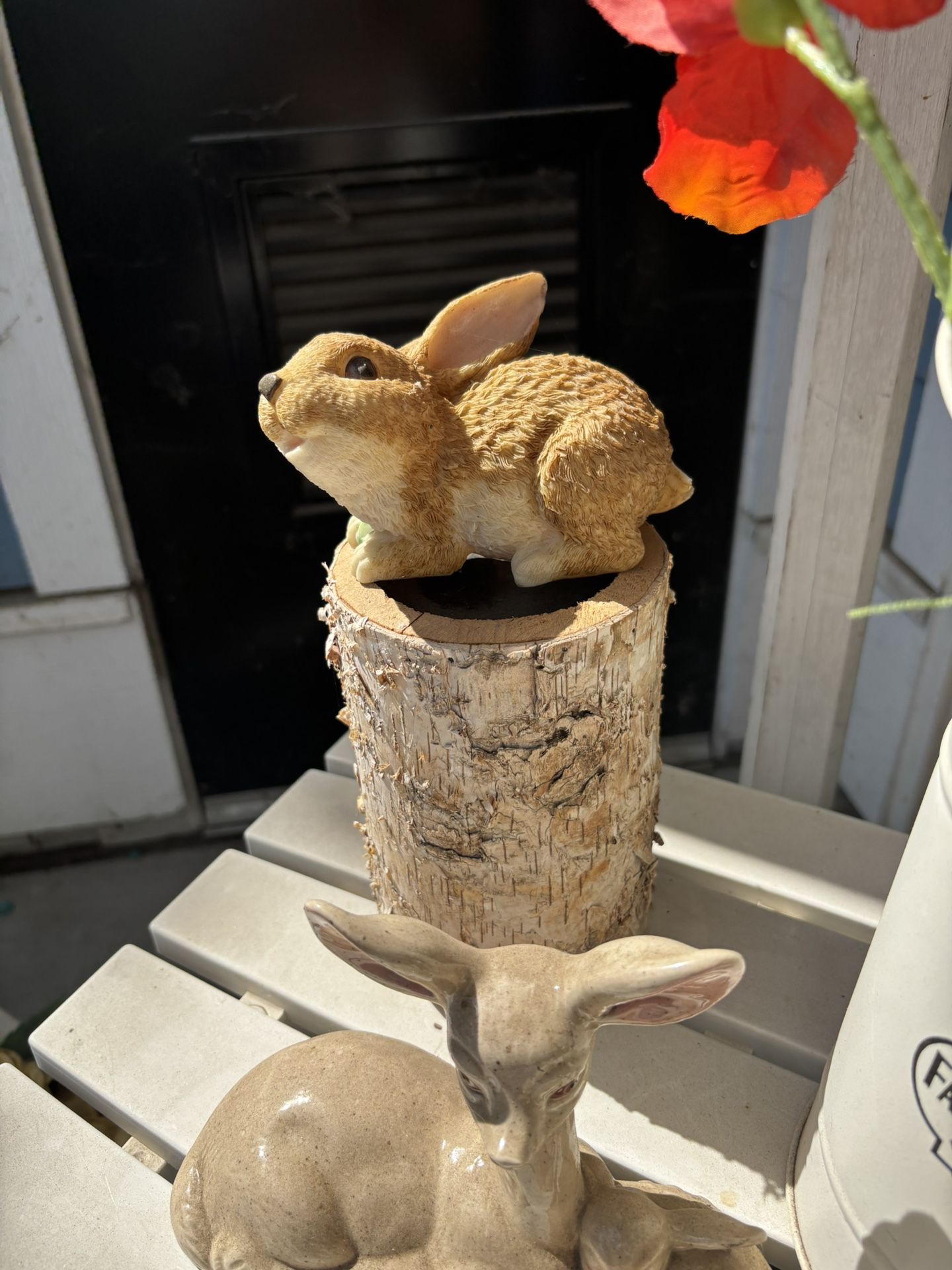 Rabbit Sitting On Wood Candle Holder