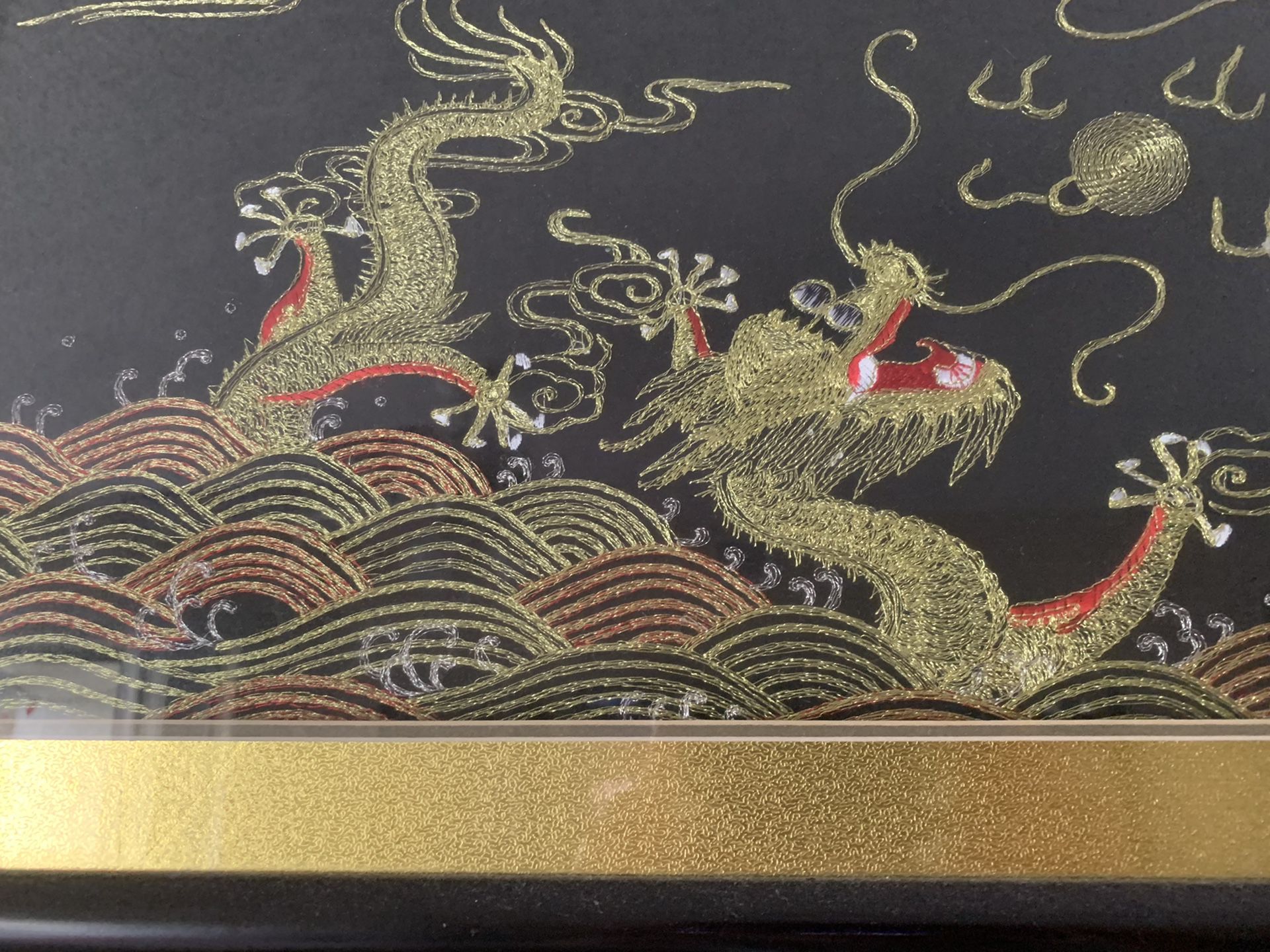 Golden stitched dragon artwork