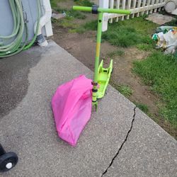 Electric Scooter With Parts In The Bag