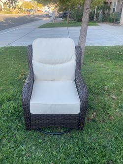Brand new single swivel chair with deep beige cushions