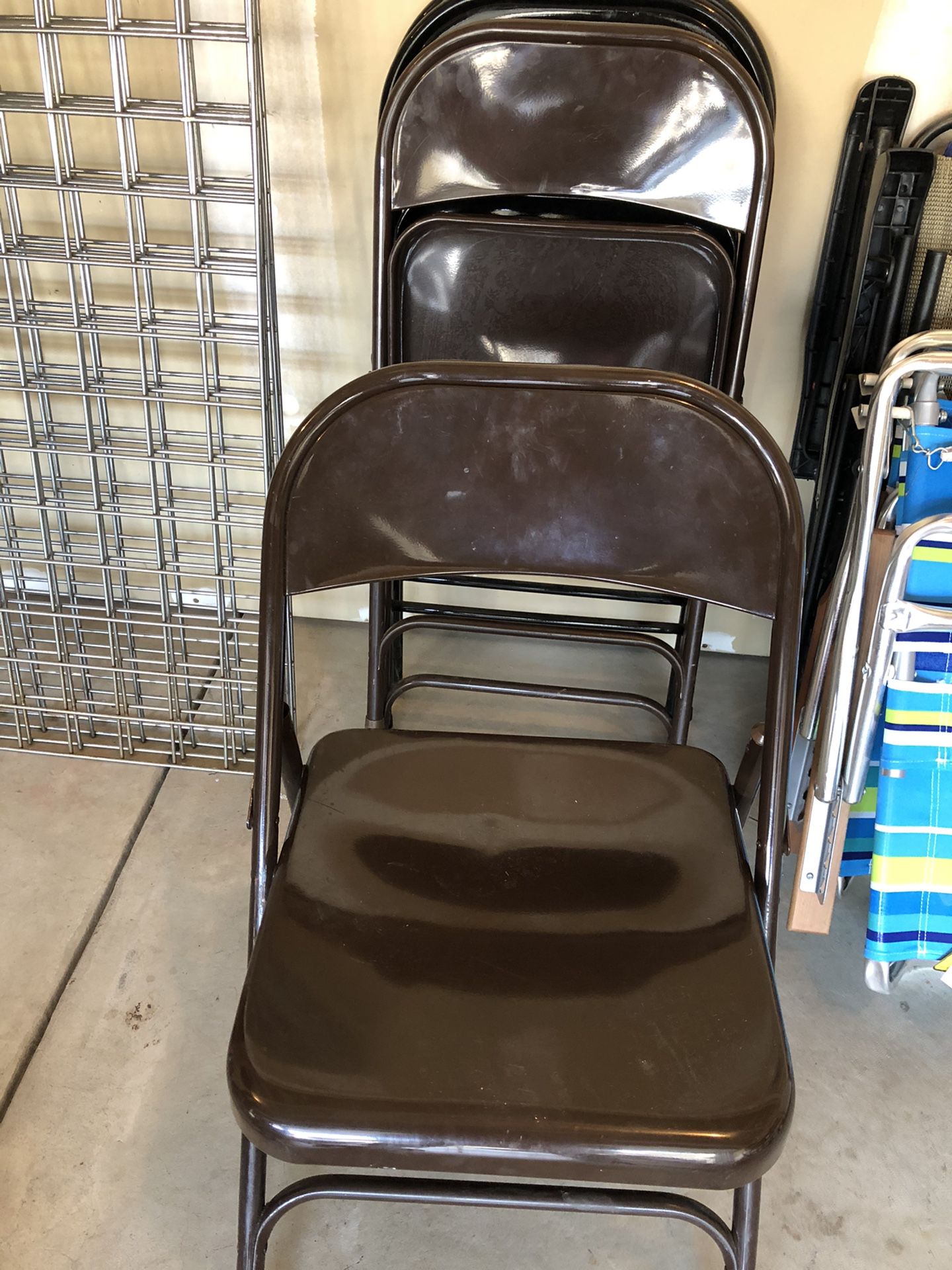 Four brown metal chairs