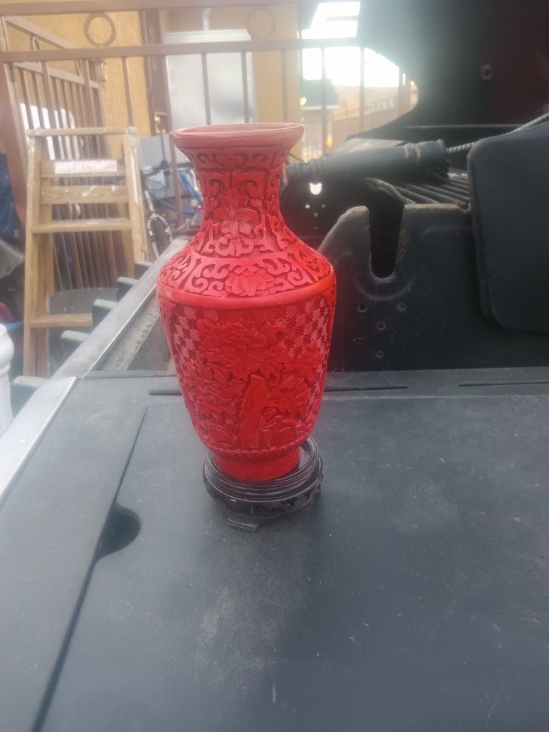 2 red vases or candle holders. 