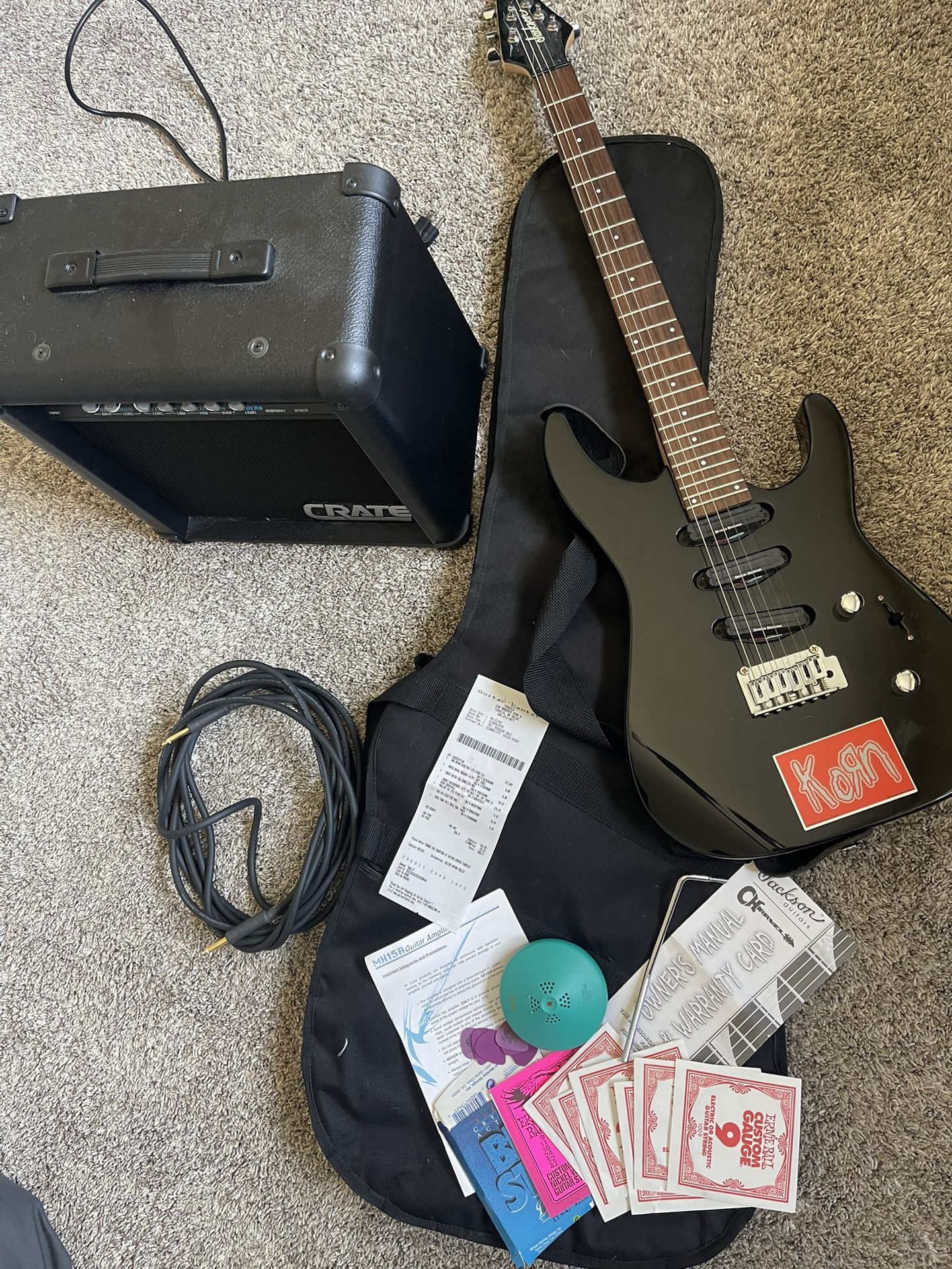 black jackson/charvel electric guitar and amp